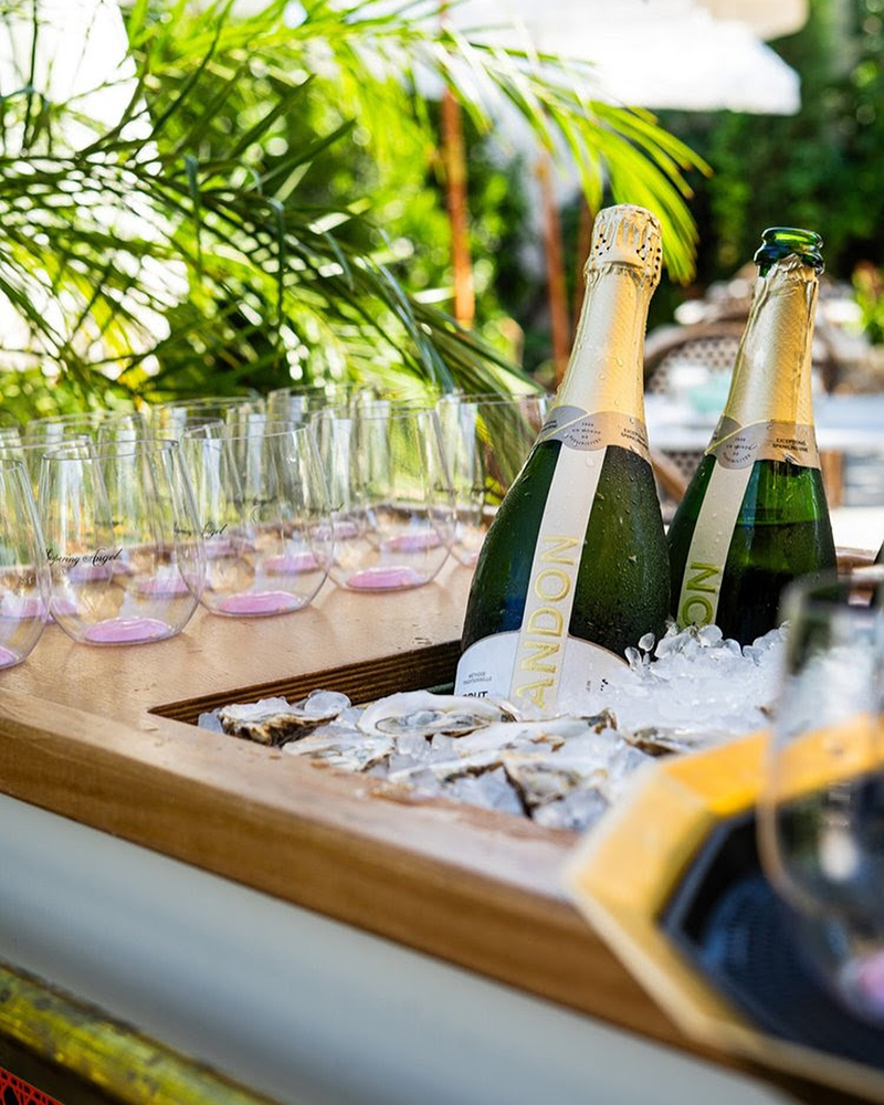Champagne bottles with glasses and oysters