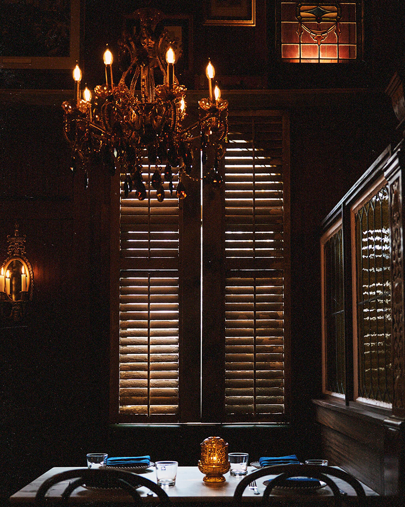 Elegant dining area with chandelier.