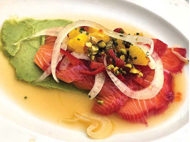 Colorful dish with fish and sauce